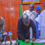 Governor Babagana Umara Zulum (2nd left) signing into law nine bills passed by the Borno State House of Assembly on Wednesday in Maiduguri. By the Governor’s left is speaker of the assembly, AbdulKarim Lawan.