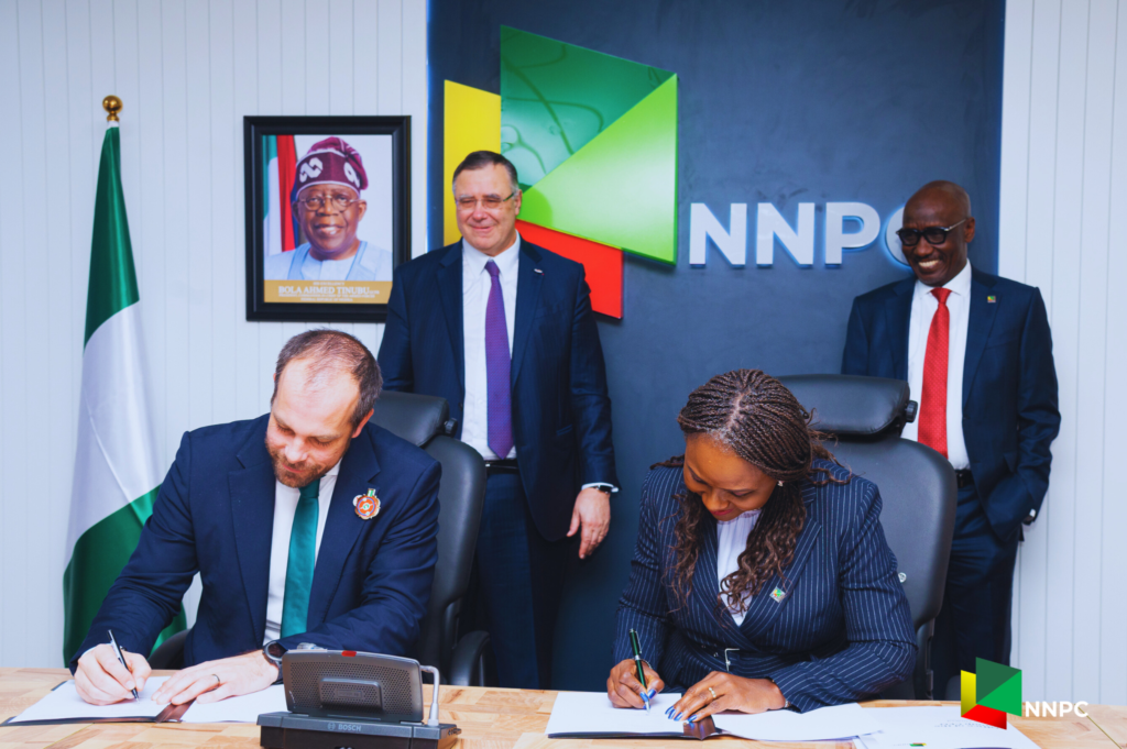 Executive Vice President, Upstream, NNPC Ltd., Oritsemeyiwa Eyesan (2nd right) and Managing Director and Country Chair, TotalEnergies EP Nigeria, Matthieu Bouyer (2nd left), display the signed MoU between NNPC Ltd. and TotalEnergies on the use of the latter’s Airborne Ultralight Spectrometer for Environment Detection (AUSEA) Technology, aimed at detecting and monitoring methane emissions in oil and gas operations. First from right is the Group Chief Executive Officer of NNPC Ltd., Mele Kyari and first from left is the Chairman and Chief Executive Officer of TotalEnergies, Patrick Pouyanné (standing left).