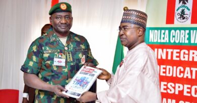 Chairman/Chief Executive Officer of the National Drug Law Enforcement Agency, NDLEA, Brig. Gen. Mohamed Buba Marwa (Retd) presenting a copy of the agency's official magazine to the Chief of Defence Staff, Gen. Christopher Musa when the latter paid him a courtesy visit at the NDLEA's national headquarters in Abuja on Monday 18th December 2023